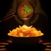 Potato chips spilling from a bag beside an FDA recall notice, illustrating a Class I salmonella contamination recall.